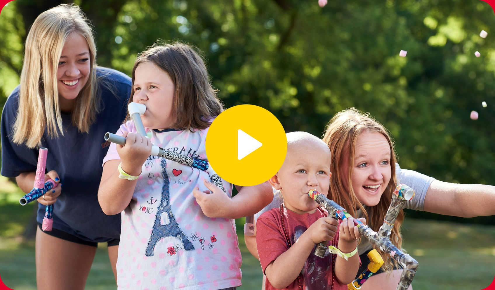 A video still image of kids playing hand-made instruments at camp.