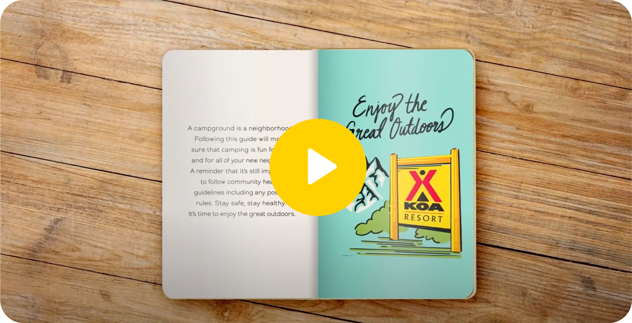 An open book with one page that says "Enjoy the Great Outdoors". A play button is ovelaid.