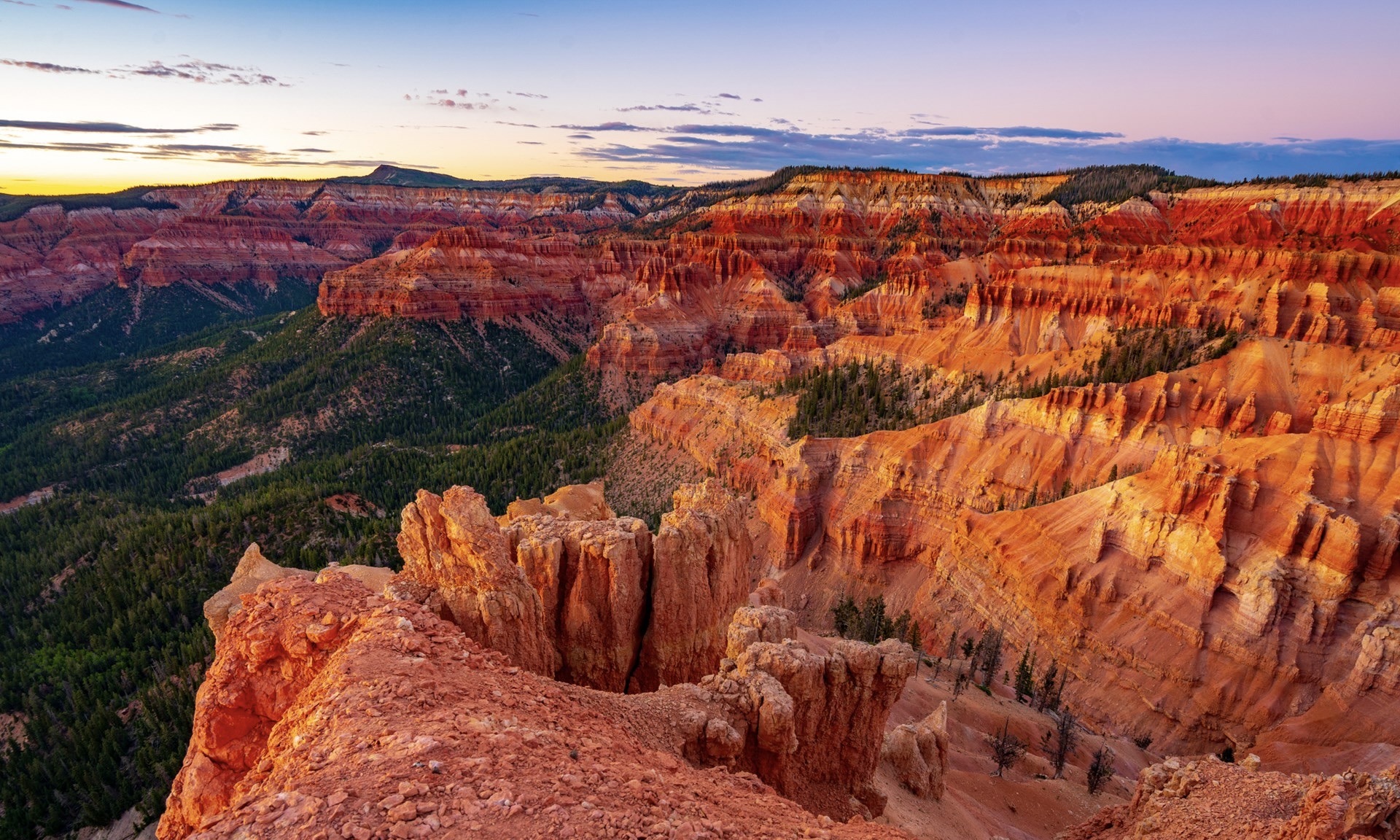 A large canyon in Cedar Breaks National Park at sunset